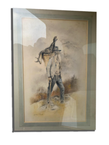 Illustration encadrée : chasseur en montagne portant un cerf sur l’épaule, avec fusil, paysage brumeux en arrière-plan (photo avec reflets sur le verre)