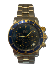 Montre chronographe de luxe vintage avec cadran bleu, compteurs secondaires, index dorés et bracelet métallique bicolore.