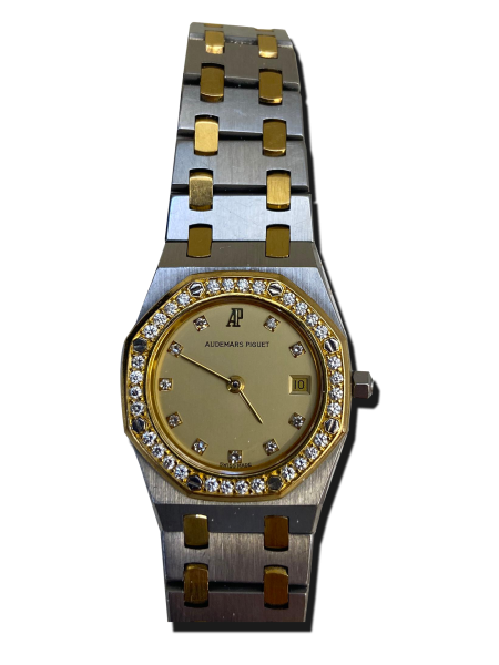 Montre vintage de luxe bicolore acier et or avec bracelet intégré, lunette octogonale sertie de pierres, cadran champagne à index sertis et guichet date ; offre de reprise.