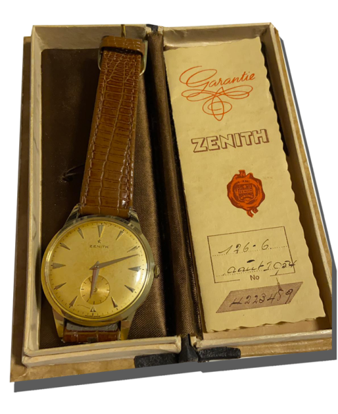 Montre vintage de luxe à cadran doré avec bracelet cuir brun, présentée dans son coffret avec document de garantie ; Rachat