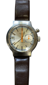 Montre vintage de luxe en acier avec cadran argenté, un compteur circulaire, guichet date et bracelet en cuir brun, photo produit