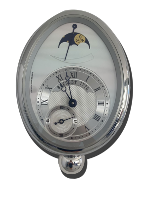 Pendulette de collection suisse ovale en métal poli, cadran guilloché à chiffres romains, petite seconde et indication de phase de lune,