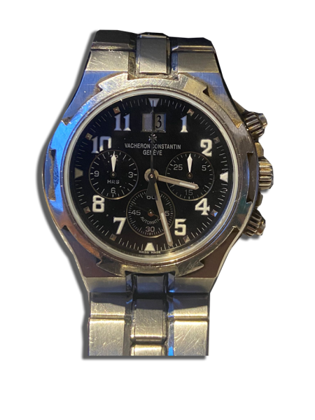 Montre vintage suisse de luxe en acier avec cadran noir, chronographe à trois compteurs et date à 12 h, bracelet métal à maillons.